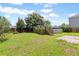 Spacious backyard featuring a wooden deck, above ground pool, mature trees and a partially fenced yard at 302 Mossy Wood Rd, Summerville, SC 29483