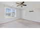 Bright bedroom with neutral walls, carpet, ceiling fan, and window; perfect for comfort and relaxation at 302 Mossy Wood Rd, Summerville, SC 29483