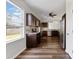 Modern kitchen with stainless steel appliances, dark cabinetry, granite countertops, and plenty of natural light at 302 Mossy Wood Rd, Summerville, SC 29483
