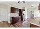 Spacious kitchen features dark wood cabinets, stainless steel appliances, and granite countertops at 302 Mossy Wood Rd, Summerville, SC 29483