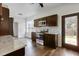 Modern kitchen with stainless steel appliances, dark cabinetry, granite countertops, and plenty of natural light at 302 Mossy Wood Rd, Summerville, SC 29483