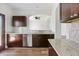 Beautiful kitchen with granite countertops, stainless steel appliances, and dark wood cabinets at 302 Mossy Wood Rd, Summerville, SC 29483