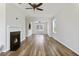 Bright living room features a decorative fireplace and hardwood floors, creating a warm and inviting space at 302 Mossy Wood Rd, Summerville, SC 29483