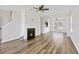 Bright living room features a decorative fireplace and hardwood floors, creating a warm and inviting space at 302 Mossy Wood Rd, Summerville, SC 29483