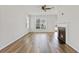 Bright living room features a decorative fireplace and hardwood floors, creating a warm and inviting space at 302 Mossy Wood Rd, Summerville, SC 29483