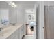 Bright bathroom featuring a double sink vanity and shower at 3020 River Vista Way, Mount Pleasant, SC 29466