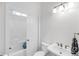 Clean bathroom with a combination shower and tub, sliding door, and classic white fixtures at 3020 River Vista Way, Mount Pleasant, SC 29466