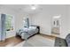 Bright bedroom featuring hardwood floors, ensuite bathroom, and abundant natural light at 3020 River Vista Way, Mount Pleasant, SC 29466