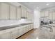 A gourmet kitchen with granite countertops, white cabinets, and stainless steel appliances at 3020 River Vista Way, Mount Pleasant, SC 29466