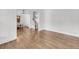 Hardwood flooring enhances the spacious living room near the stairway and adjacent dining area at 3020 River Vista Way, Mount Pleasant, SC 29466