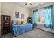 Cozy bedroom with daybed, bookshelves, a ceiling fan, and a window at 312 Barberry St, Summerville, SC 29483