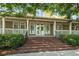 Inviting clubhouse entrance featuring brick steps, double doors, and a charming covered porch for community members at 312 Barberry St, Summerville, SC 29483