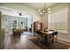 Dining room with wood table, decorative light fixture, and view into the adjacent living room at 312 Barberry St, Summerville, SC 29483