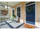 Inviting front porch with seating, blue door with wreath, and 'hello' doormat creating a warm and welcoming entrance at 312 Barberry St, Summerville, SC 29483