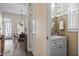 Well lit powder room with decorative wall paper and a door leading to a breakfast nook at 312 Barberry St, Summerville, SC 29483