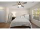 Bright bedroom with ceiling fan, and light-colored walls and flooring at 312 Kelsey Blvd, Wando, SC 29492