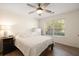 Cozy bedroom featuring hardwood floors, a ceiling fan, and a window with natural light at 312 Kelsey Blvd, Wando, SC 29492