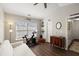 Bright bedroom offers a comfortable area with a futon, a spinning bike, and ample natural light at 312 Kelsey Blvd, Wando, SC 29492
