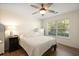 Cozy bedroom featuring hardwood floors, a ceiling fan, and a window with natural light at 312 Kelsey Blvd, Wando, SC 29492