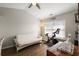 Bright bedroom offers a comfortable area with a futon, a spinning bike, and ample natural light at 312 Kelsey Blvd, Wando, SC 29492