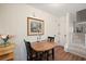 Cozy dining area with hardwood floors, table with seating, next to staircase and leading to the living area at 312 Kelsey Blvd, Wando, SC 29492