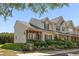 Well-maintained townhome with a landscaped front yard and charming facade at 312 Kelsey Blvd, Wando, SC 29492