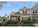 Charming townhome featuring a manicured lawn and inviting front porch at 312 Kelsey Blvd, Wando, SC 29492