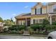 Charming townhome with manicured landscaping and classic design elements at 312 Kelsey Blvd, Wando, SC 29492