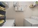 Functional laundry area with shelving for storage and side by side washer and dryer at 312 Kelsey Blvd, Wando, SC 29492