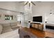 Bright living room with a soaring ceiling, hardwood floors, and a TV at 312 Kelsey Blvd, Wando, SC 29492