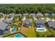 A high angle shows the neighborhood, highlighting the large lots and in-ground pools at 3274 Arrow Arum Dr, Johns Island, SC 29455