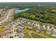 An aerial perspective of the neighborhood, with the surrounding nature and ponds at 3274 Arrow Arum Dr, Johns Island, SC 29455