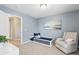 Calm bedroom with soft blue walls and comfortable furniture at 3274 Arrow Arum Dr, Johns Island, SC 29455