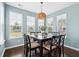 Dining area illuminated by natural light showcasing a wooden table with seating for eight at 3274 Arrow Arum Dr, Johns Island, SC 29455