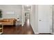 Hallway featuring hardwood floors, a stylish sofa, and neutral wall color at 3274 Arrow Arum Dr, Johns Island, SC 29455