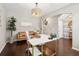 Stylish home office with hardwood floors, a contemporary desk, leather sofa, and bright, natural light at 3274 Arrow Arum Dr, Johns Island, SC 29455