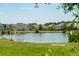An expansive pond view with homes nestled in the surrounding neighborhood at 3274 Arrow Arum Dr, Johns Island, SC 29455