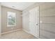 Empty walk-in closet features wire shelving, neutral carpet, and a window at 3274 Arrow Arum Dr, Johns Island, SC 29455