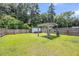 Large backyard featuring a pergola, well-kept lawn, and a storage shed, offering ample space for recreation at 331 Saddlewood Dr, Charleston, SC 29414