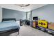 Blue bedroom with ceiling fan, window, and television at 331 Saddlewood Dr, Charleston, SC 29414
