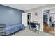Comfortable bedroom featuring carpeted floors, blue accent wall, closet, and desk at 331 Saddlewood Dr, Charleston, SC 29414