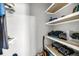 A closet with shelving, clothes, and an acoustic guitar at 331 Saddlewood Dr, Charleston, SC 29414