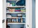 Organized closet with shelves storing cleaning and personal items at 331 Saddlewood Dr, Charleston, SC 29414
