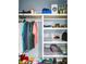 Organized closet with shelves, clothes, and toys at 331 Saddlewood Dr, Charleston, SC 29414