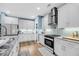 Bright kitchen featuring white cabinets, stainless steel appliances, and stylish backsplash at 331 Saddlewood Dr, Charleston, SC 29414