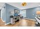 Functional office with a computer, printer, desk, and a view from the window, providing a comfortable workspace at 331 Saddlewood Dr, Charleston, SC 29414