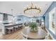 Open-concept kitchen and living area with a large island, stone countertops, and ample seating at 331 Saddlewood Dr, Charleston, SC 29414