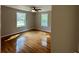 Cozy bedroom with hardwood floors and two bright windows at 365 W Pine St, Varnville, SC 29944