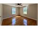 Bedroom featuring hardwood floors and two bright windows at 365 W Pine St, Varnville, SC 29944