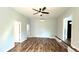 Inviting living room with a modern ceiling fan, mini-split climate control, and new wood-look laminate flooring at 365 W Pine St, Varnville, SC 29944